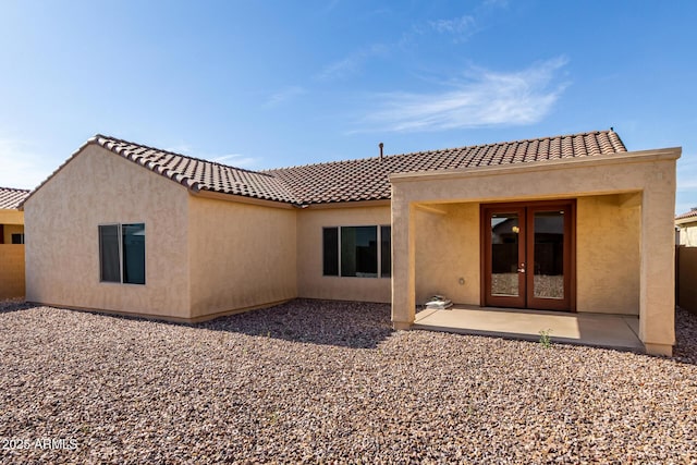 6331 W Desert Blossom Way, Florence, AZ 85132 - back of property featuring french doors, stucco siding, a patio, and a tiled roof