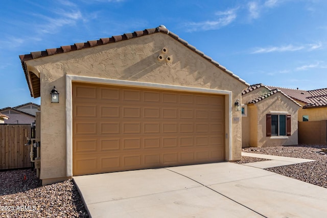 6331 W Desert Blossom Way, Florence, AZ 85132 - view of front facade with stucco siding, a garage, concrete driveway, and a tiled roof