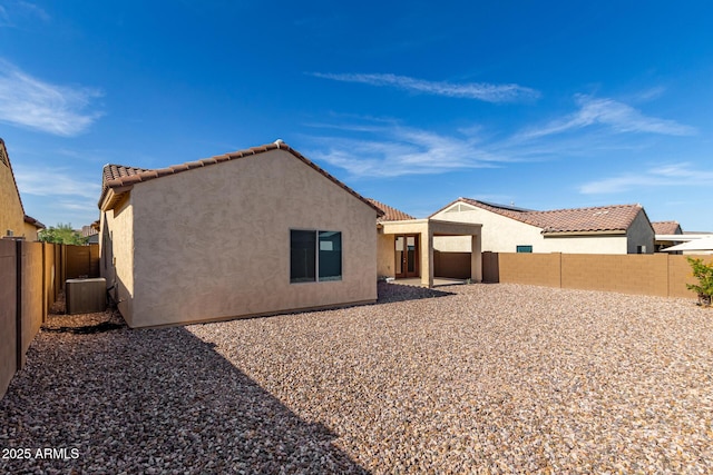 6331 W Desert Blossom Way, Florence, AZ 85132 - back of house with stucco siding, central air condition unit, a fenced backyard, and a tile roof