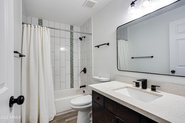 full bath featuring shower / bath combination with curtain, visible vents, toilet, vanity, and wood finished floors