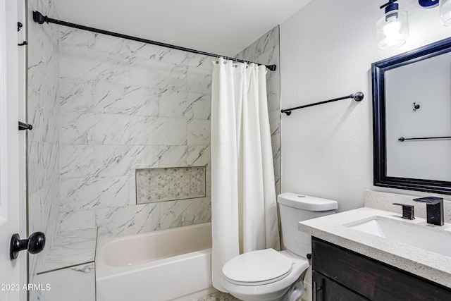 full bathroom featuring toilet, shower / tub combo, a textured wall, and vanity