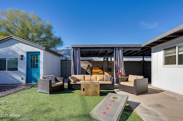 view of patio / terrace with an outdoor hangout area, an outbuilding, and fence