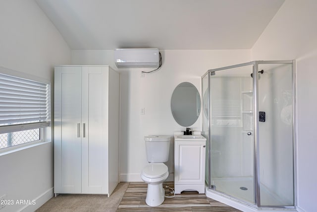 bathroom with toilet, a wall mounted AC, a stall shower, a sink, and baseboards