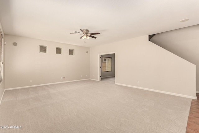 17419 W Elaine Dr, Goodyear, AZ 85338 - unfurnished living room featuring ceiling fan and light carpet
