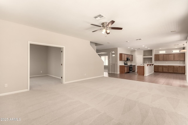 17419 W Elaine Dr, Goodyear, AZ 85338 - unfurnished living room with light carpet, a ceiling fan, and recessed lighting