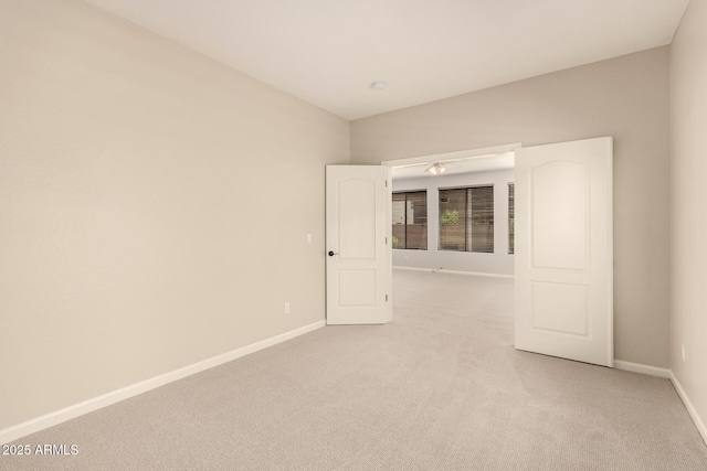 17419 W Elaine Dr, Goodyear, AZ 85338 - spare room featuring light carpet and baseboards
