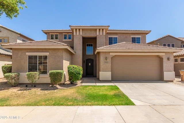 17419 W Elaine Dr, Goodyear, AZ 85338 - view of front of property featuring a garage, driveway, stucco siding, a front lawn, and a tile roof