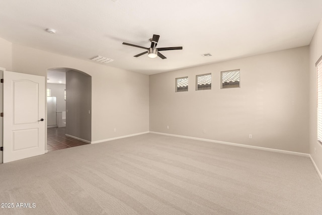 17419 W Elaine Dr, Goodyear, AZ 85338 - carpeted spare room featuring arched walkways, a ceiling fan, and a smoke detector