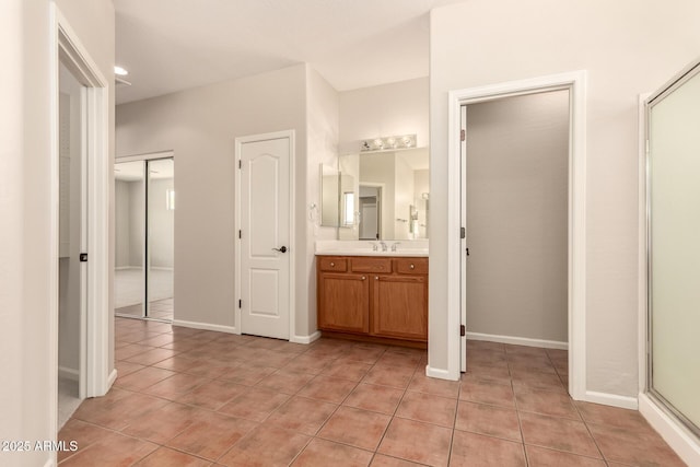 17419 W Elaine Dr, Goodyear, AZ 85338 - bathroom featuring vanity, tile patterned floors, and a shower with door