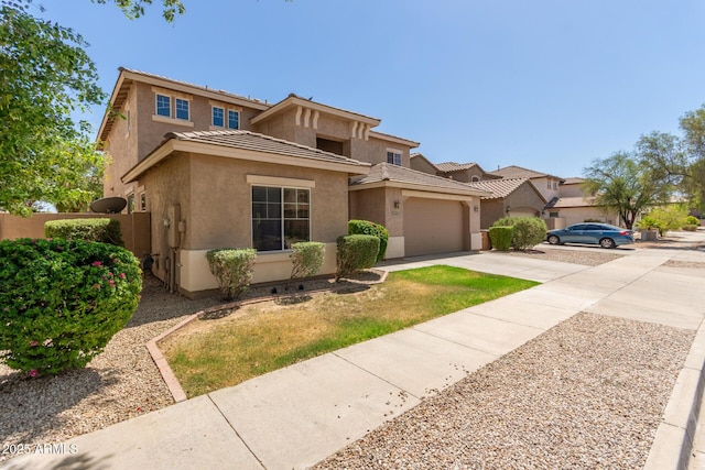 17419 W Elaine Dr, Goodyear, AZ 85338 - view of front of house with concrete driveway, stucco siding, an attached garage, and a tiled roof