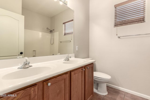 17419 W Elaine Dr, Goodyear, AZ 85338 - bathroom featuring a shower, double vanity, and tile patterned floors