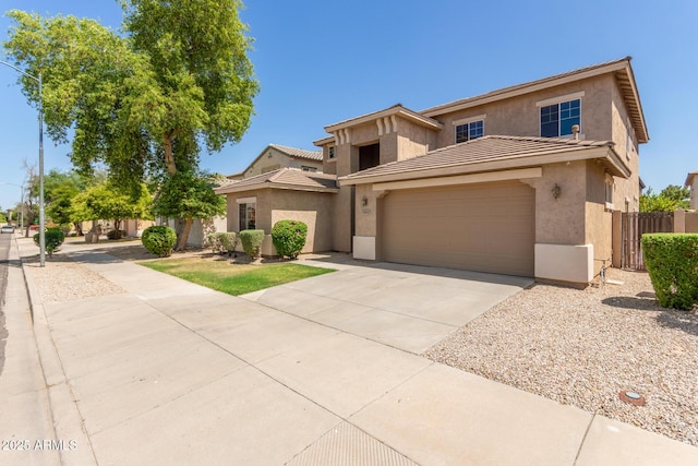17419 W Elaine Dr, Goodyear, AZ 85338 - view of front of property with stucco siding, concrete driveway, an attached garage, and a tile roof