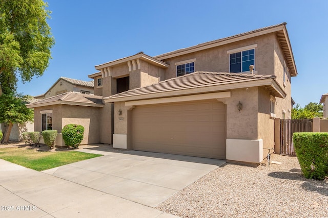 17419 W Elaine Dr, Goodyear, AZ 85338 - view of front of home with stucco siding, concrete driveway, a tile roof, and a garage