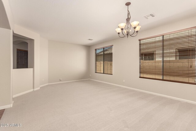 17419 W Elaine Dr, Goodyear, AZ 85338 - spare room with a chandelier and light colored carpet