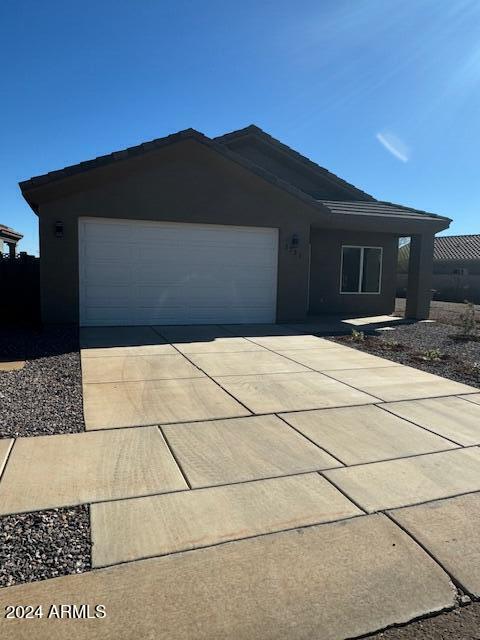 ranch-style home with a garage