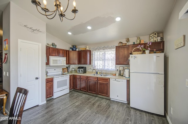23993 N Desert Dr, Florence, AZ 85132 - kitchen featuring white appliances, a sink, a chandelier, light countertops, and dark wood-type flooring