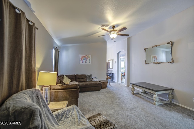 23993 N Desert Dr, Florence, AZ 85132 - carpeted living area with arched walkways and a ceiling fan