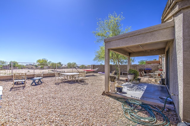 23993 N Desert Dr, Florence, AZ 85132 - view of yard featuring a patio, outdoor dining space, and fence
