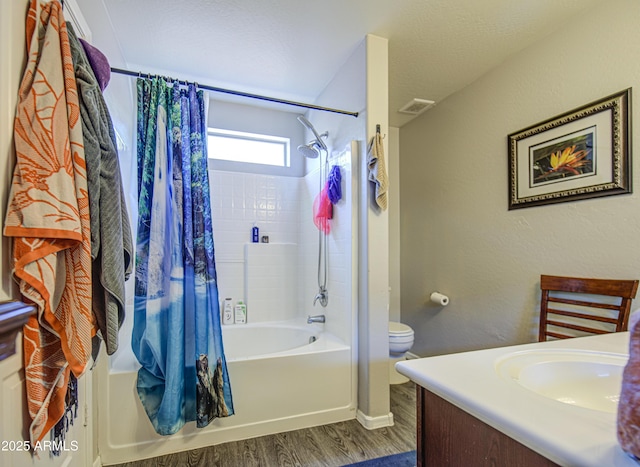 23993 N Desert Dr, Florence, AZ 85132 - full bath with wood finished floors, shower / bath combo with shower curtain, toilet, vanity, and baseboards