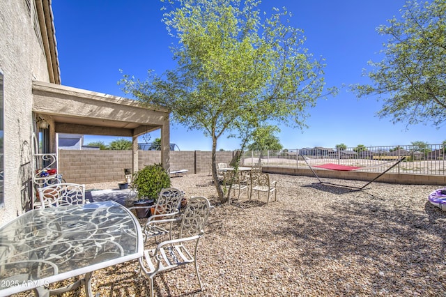 23993 N Desert Dr, Florence, AZ 85132 - fenced backyard featuring a patio area and outdoor dining area