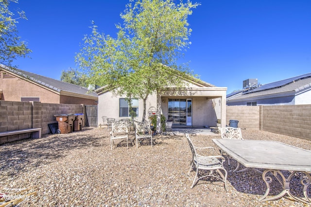 23993 N Desert Dr, Florence, AZ 85132 - back of house with a fenced backyard, cooling unit, a patio, and stucco siding
