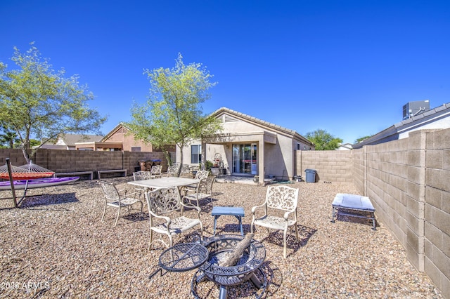 23993 N Desert Dr, Florence, AZ 85132 - rear view of property featuring a fenced backyard, stucco siding, and central AC