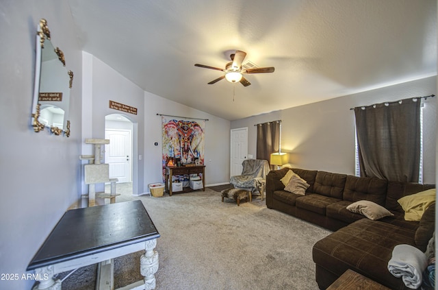23993 N Desert Dr, Florence, AZ 85132 - living room with ceiling fan, carpet floors, arched walkways, vaulted ceiling, and baseboards