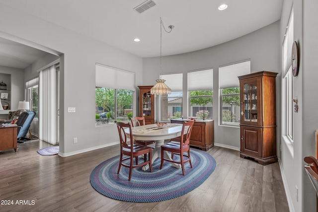 dining room with hardwood / wood-style flooring