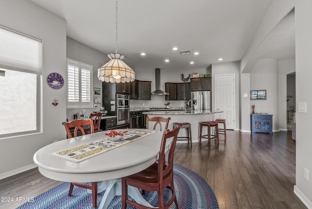 dining space featuring dark hardwood / wood-style floors