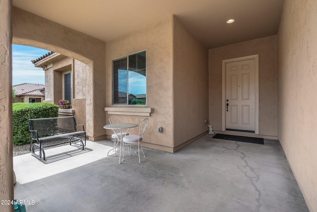 property entrance featuring a patio