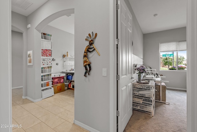 hallway with light tile flooring