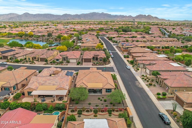 birds eye view of property with a mountain view