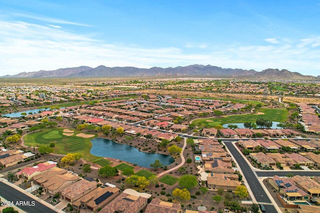 birds eye view of property featuring a water and mountain view