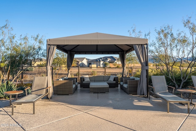 view of patio / terrace featuring an outdoor living space and a gazebo