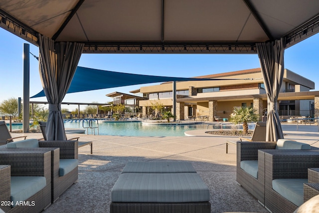 view of swimming pool featuring a gazebo and a patio