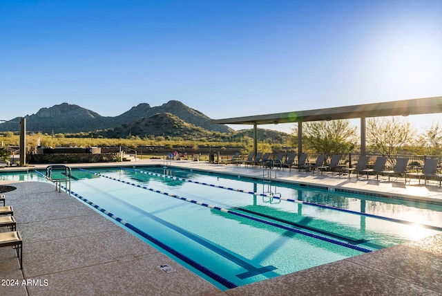 view of swimming pool featuring a mountain view