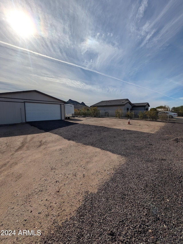 view of yard featuring an outbuilding and a garage