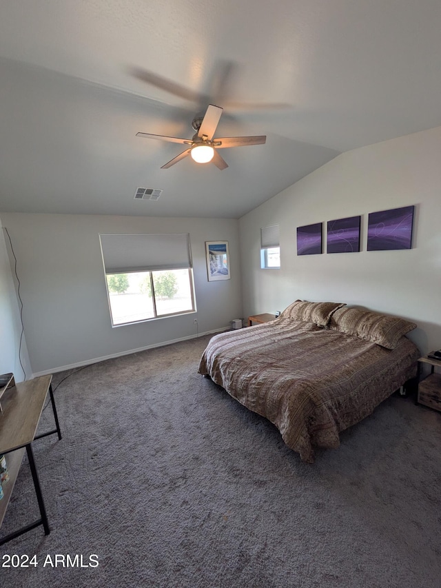 bedroom featuring carpet, ceiling fan, and vaulted ceiling