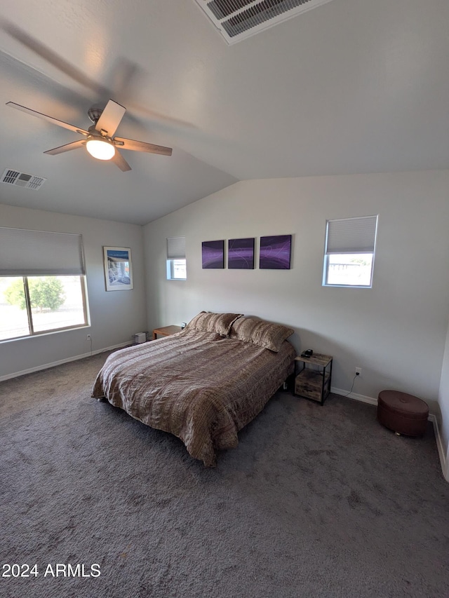 carpeted bedroom with ceiling fan and lofted ceiling