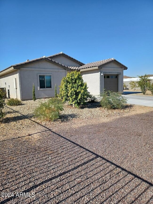 view of property exterior with a garage