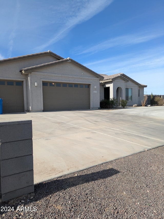 single story home with a garage