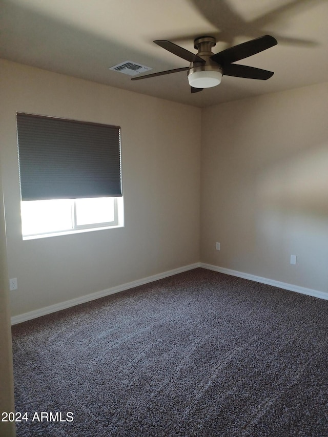 empty room with carpet and ceiling fan