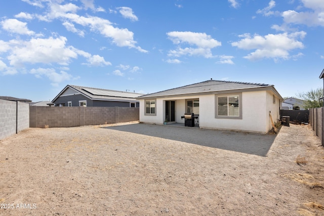 back of house with a patio area