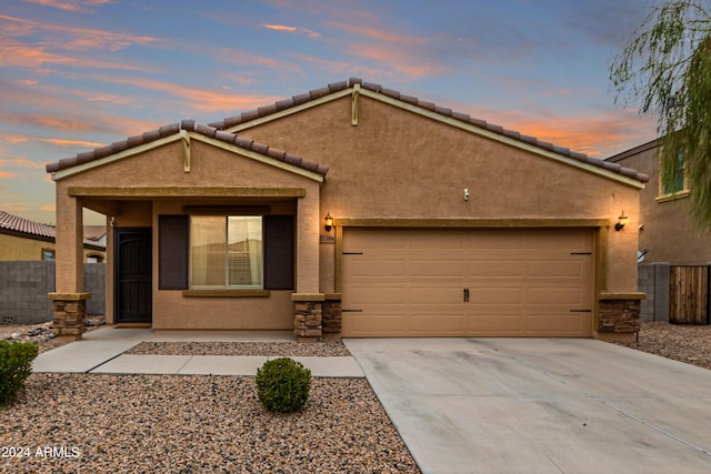 view of front of home with a garage