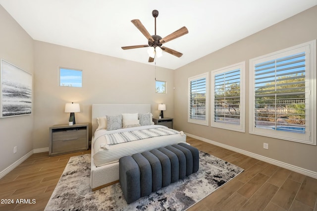 20594 W Pasadena Ave, Buckeye, AZ 85396 - bedroom with light wood-style flooring, baseboards, and ceiling fan