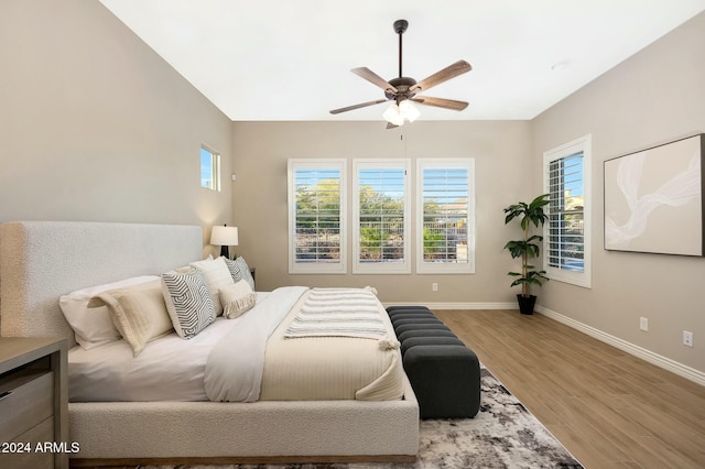 bedroom featuring hardwood / wood-style flooring and ceiling fan