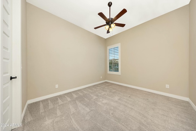 empty room featuring light carpet and ceiling fan