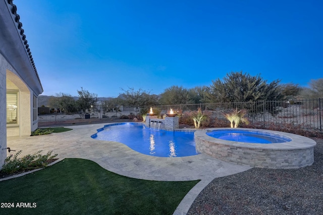 20594 W Pasadena Ave, Buckeye, AZ 85396 - view of swimming pool featuring a patio and a pool with connected hot tub