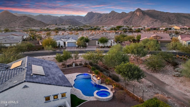 pool at dusk with a mountain view