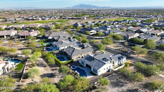 birds eye view of property featuring a mountain view